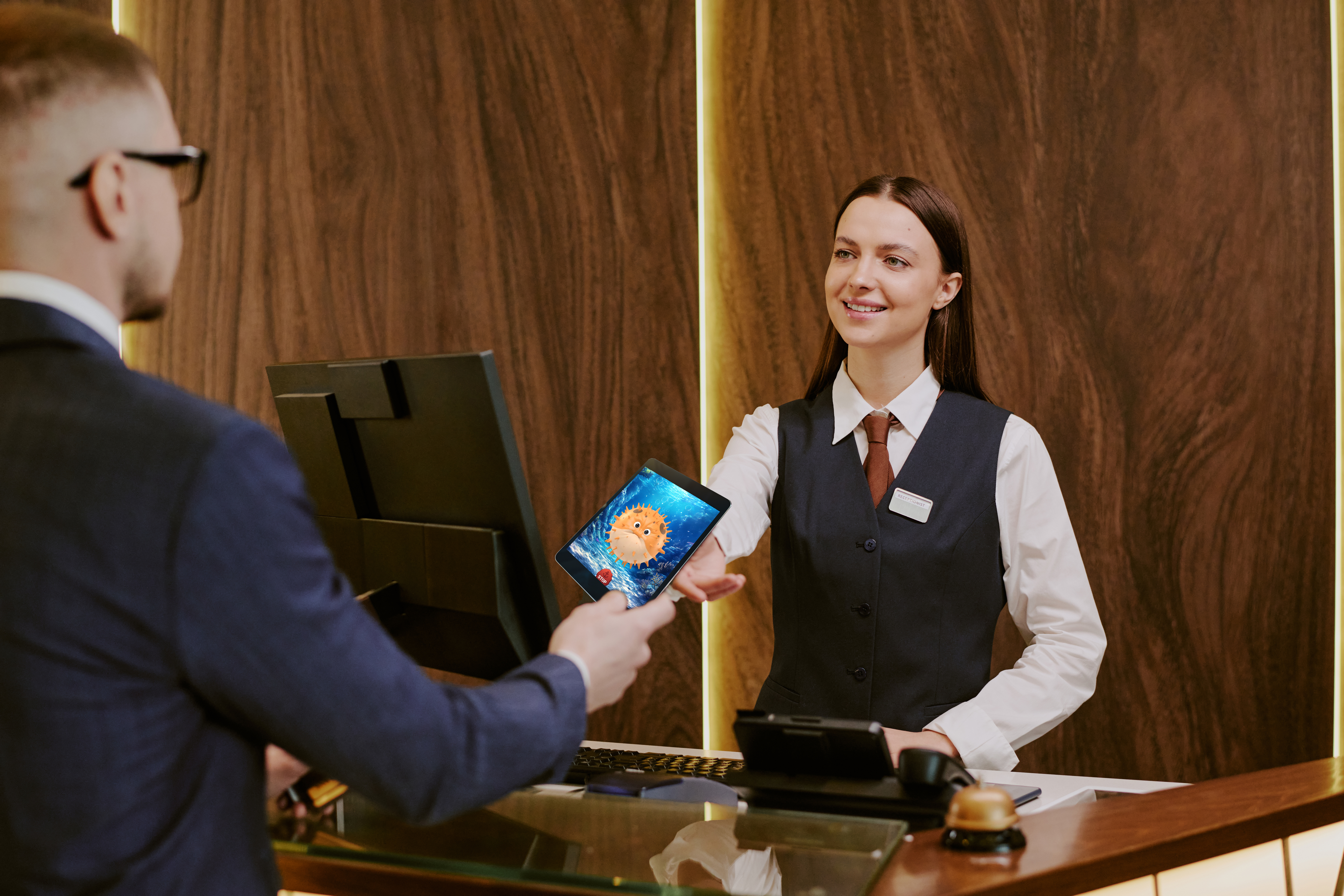 Customer playing a loyalty recognition game at a players club desk